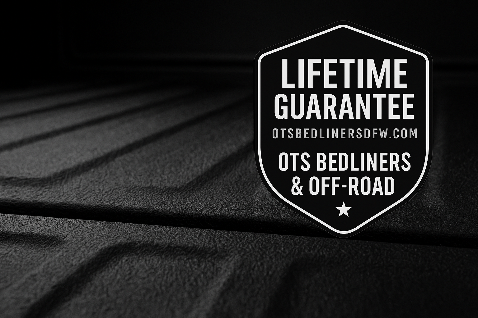 Textured spray on bedliner with 'Lifetime Guarantee' and 'OTS Bedliners & Off-Road' logo near frisco Texas.